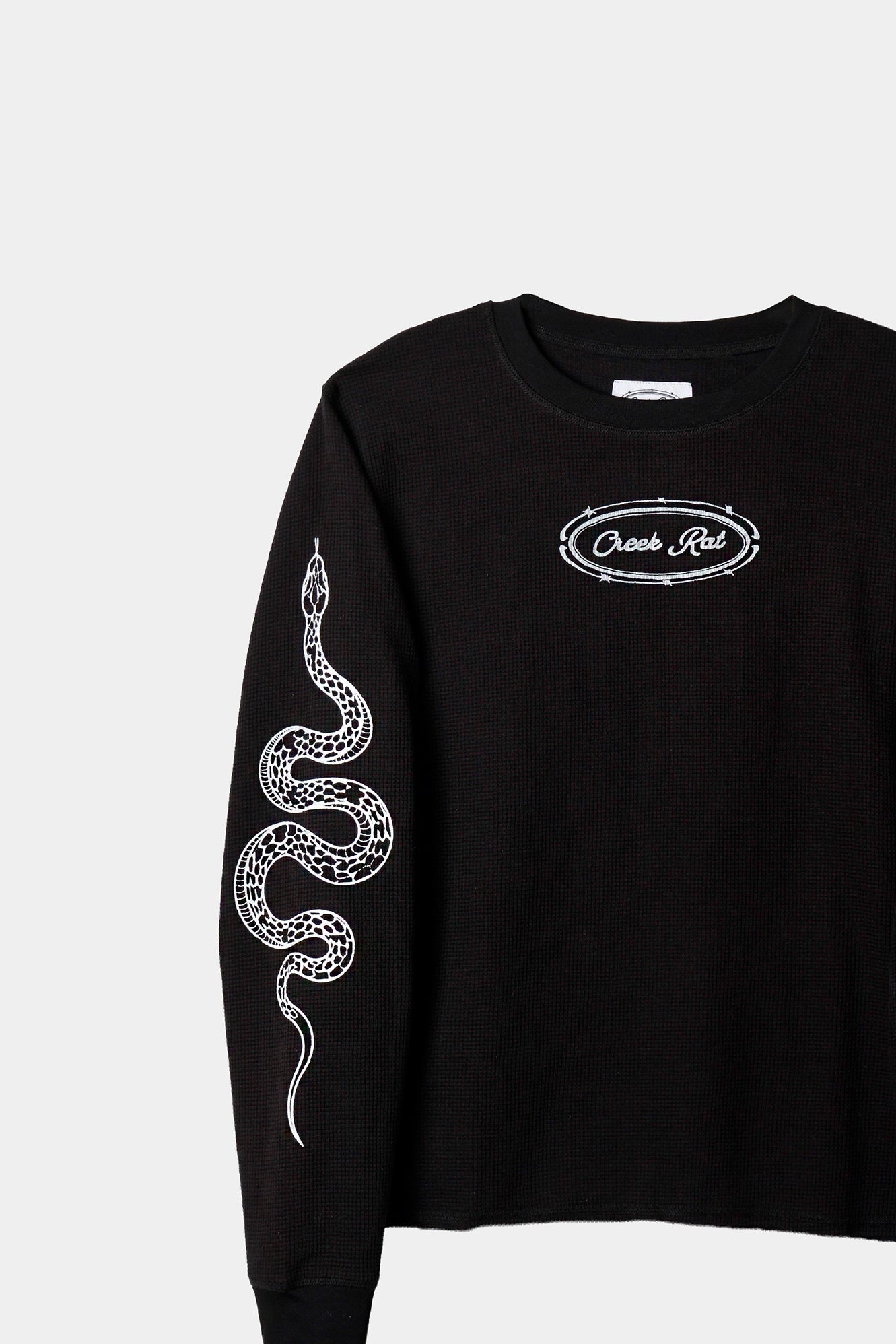 Black sweatshirt with snake designs on sleeves and a logo on chest against a white background